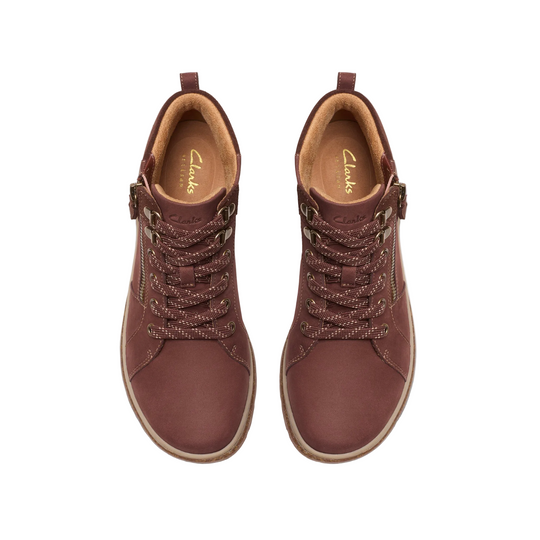 A pair of Clarks lace-up ankle boots in a deep burgundy brown, shown from a top-down view on a white background.