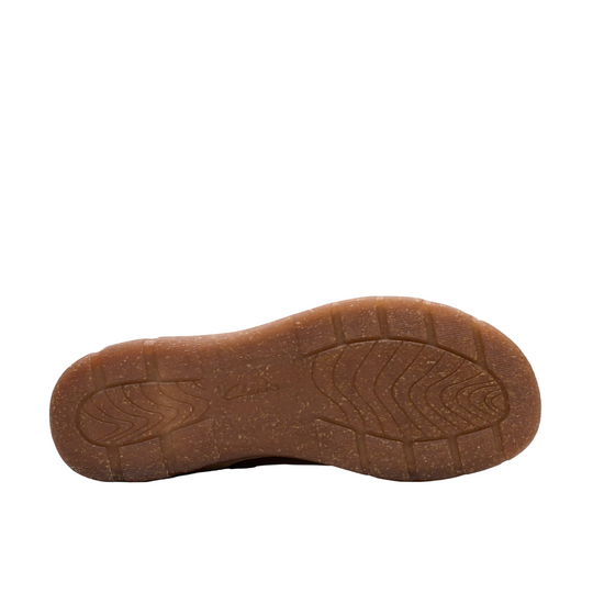 A close-up view of a brown textured rubber shoe sole, showing the tread pattern, against a solid white background.