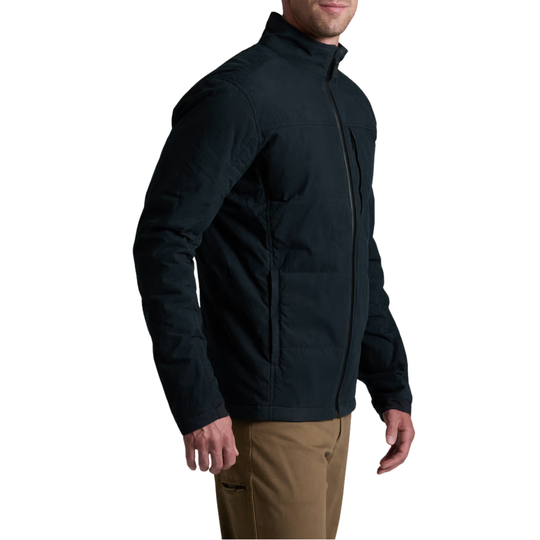 A man wearing a black zip-up puffer jacket, shown from the side against a plain white background.