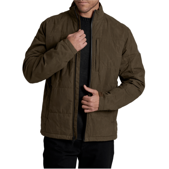 A man wearing an olive brown zip-up jacket over a black shirt, shown from the chin down against a plain white background.