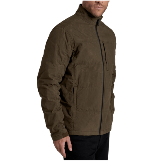 A man wearing a dark brown puffer jacket with a high collar and black zipper details, shown from the side against a plain white background.