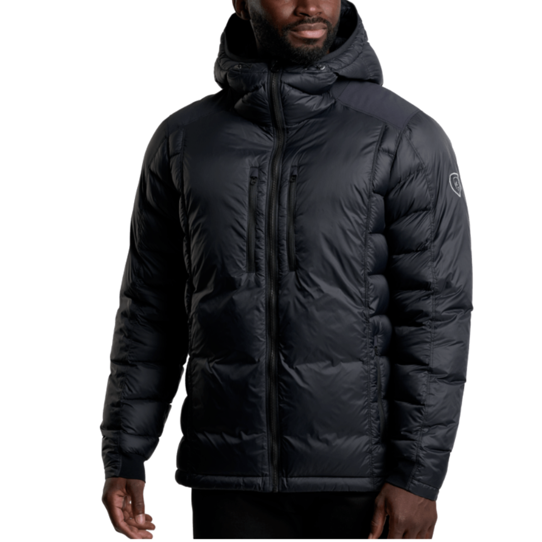 A man wearing a black hooded puffer jacket with horizontal quilting, shown from the chin down against a plain white background.