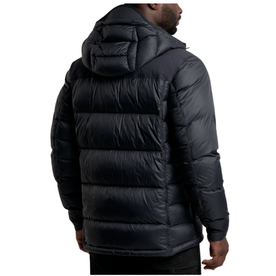 A man wearing a black hooded puffer jacket, shown from the back against a plain white background.
