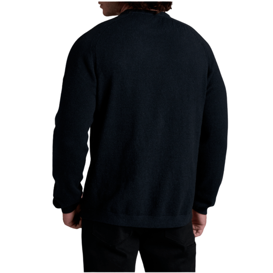 A person shown from the back wearing a dark navy long-sleeve knit top or sweater against a plain white background.