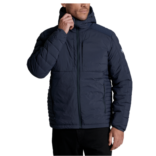 A man wearing a navy blue hooded puffer jacket, shown from the chin down against a plain white background.
