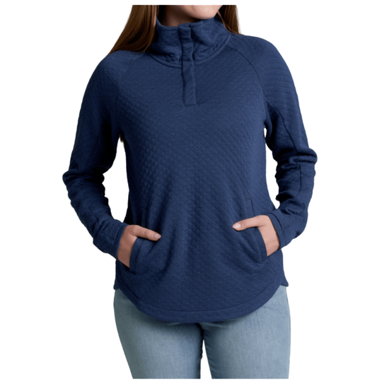 A woman wearing a navy blue long-sleeve quarter-zip pullover with a quilted texture and side pockets, paired with light blue jeans, shown against a plain white background.