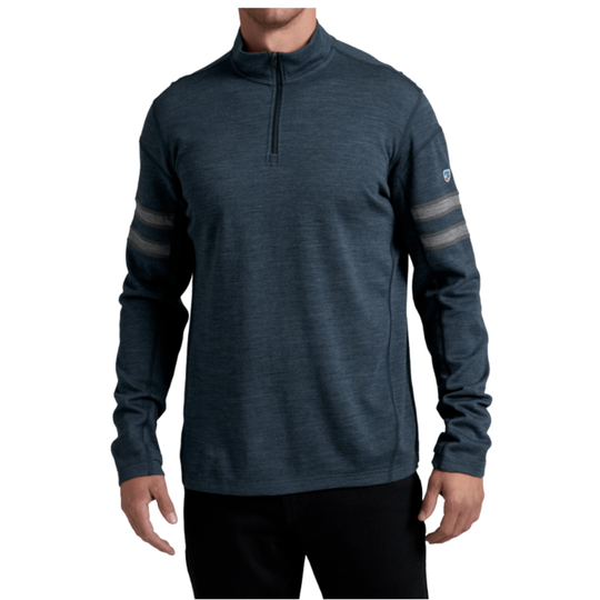 A man wearing a dark heathered blue quarter-zip long-sleeve shirt with gray stripes on the sleeves, shown against a plain white background.