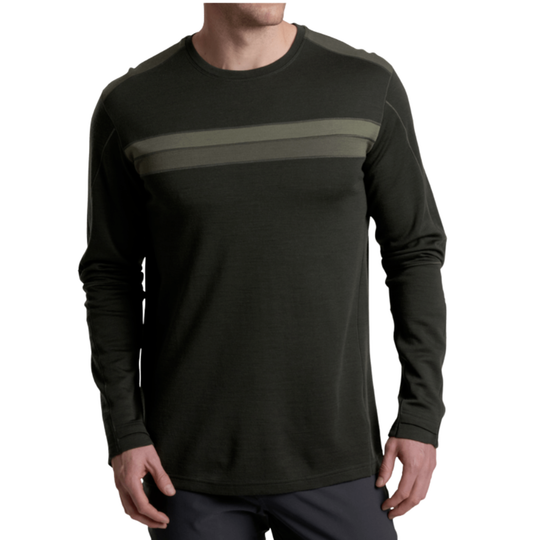 A man wearing a dark olive green long-sleeve crewneck shirt with a horizontal olive stripe across the chest, shown from the neck down against a plain white background.