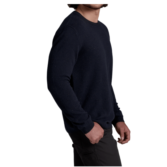 A man wearing a dark navy blue crewneck sweater, shown from a side profile against a plain white background.