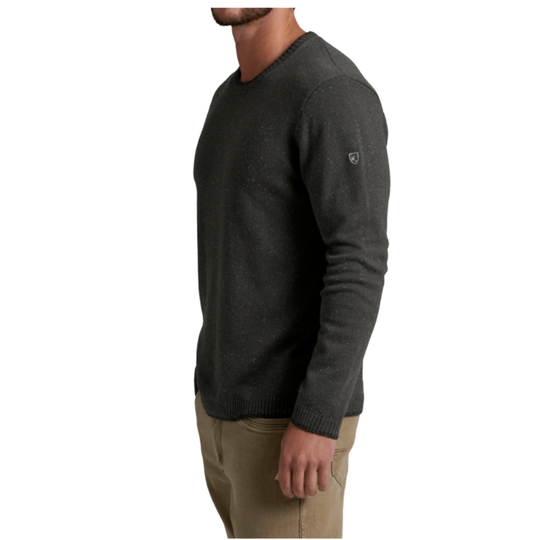 A man wearing a dark charcoal gray knit crewneck sweater, shown in a side profile view against a plain white background.