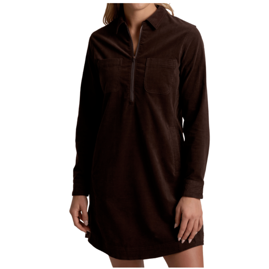 A woman wearing a dark brown corduroy shirt dress with a half-zip collar and chest pockets, shown against a plain white background.