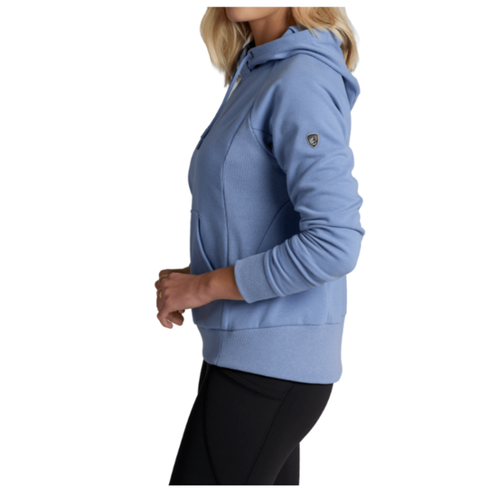 A woman wearing a light blue hooded sweatshirt and black leggings, shown in profile against a plain white background.
