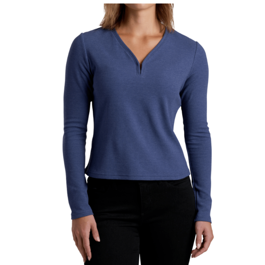 A woman wearing a blue long-sleeve ribbed V-neck quarter-zip sweater, paired with black pants, shown against a plain white background.
