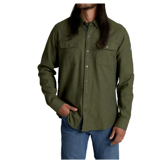 A man wearing an olive green long-sleeve button-up shirt, shown from a front profile against a plain white background.
