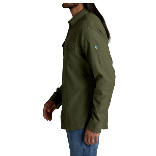A man wearing an olive green long-sleeve button-up shirt, shown from a side profile against a plain white background.