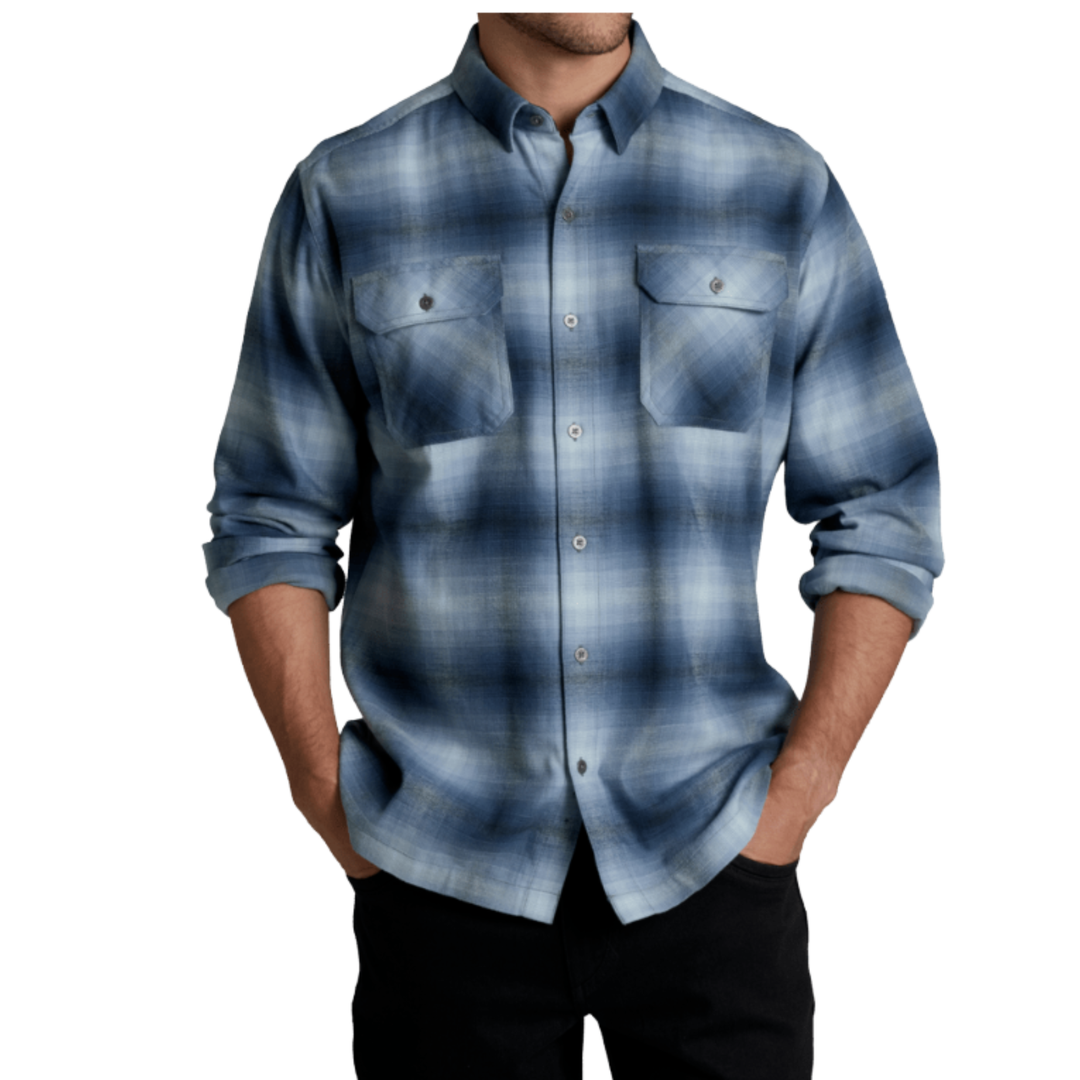 A man wearing a blue and gray plaid button-down shirt with rolled-up sleeves and black pants, shown from the chin down against a plain white background.