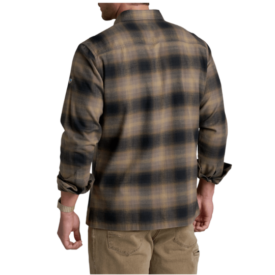 A man wearing a brown and black plaid flannel shirt, shown from the back against a plain white background.