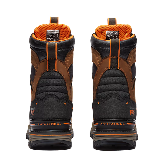 A pair of high-top winter boots shown from the back, featuring a black and brown design with bright orange accents, including an orange interior lining and pull tabs.
