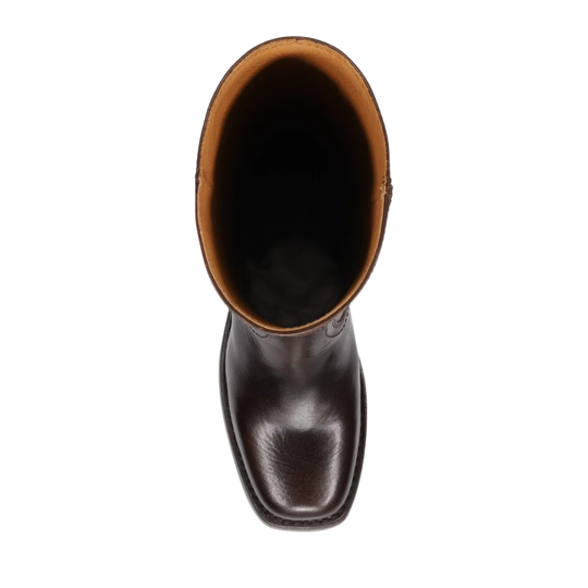 A top-down view of a dark brown leather boot with a square toe and a tan inner collar, shown against a plain white background.