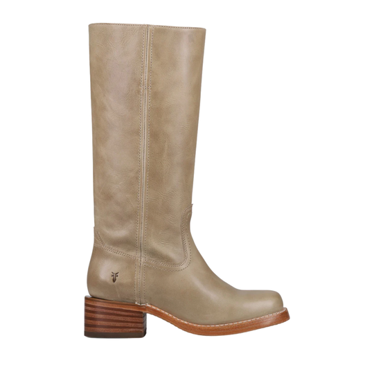 A single mid-calf leather boot in a light taupe-beige color, featuring a stacked brown block heel and a small embroidered logo on the side, shown against a plain white background.