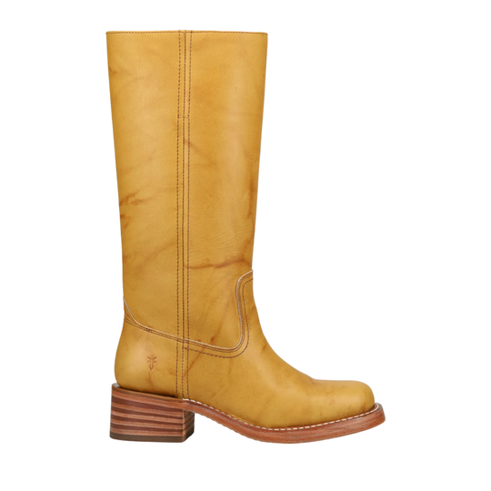 A single mid-calf leather boot in a warm mustard yellow color, featuring a stacked brown block heel and a low brown outsole, shown against a plain white background.