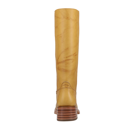 A single tall boot shown from the back on a plain white background. The boot is made of smooth mustard-yellow leather with subtle natural marbling and has a stacked brown wooden heel.