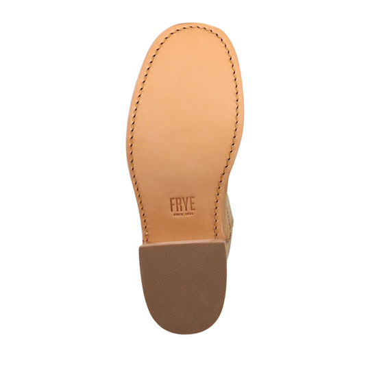 Top-down view of a light tan leather shoe sole with visible stitching and the embossed brand name 'Frye' on a white background.