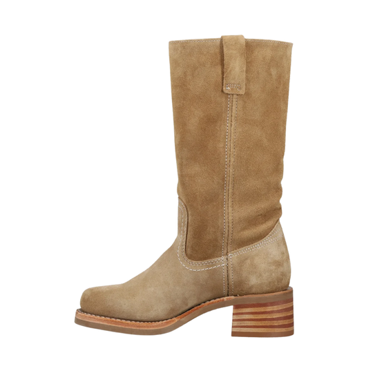 A mid-calf western boot in tan suede with a stacked wood-look block heel, shown from a side profile on a white background.