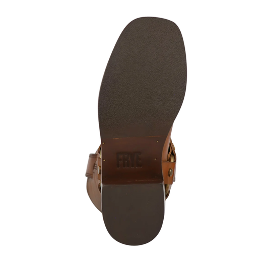 Top-down view of a brown leather sandal showing the outsole and side strap details on a white background.