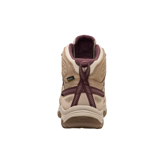 A single mid-cut hiking boot shown from the back on a solid white background. The boot features a beige suede and mesh upper with dark burgundy laces and matching burgundy heel detail.