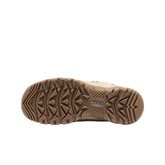 Beige shoe with a textured sole on a white background
