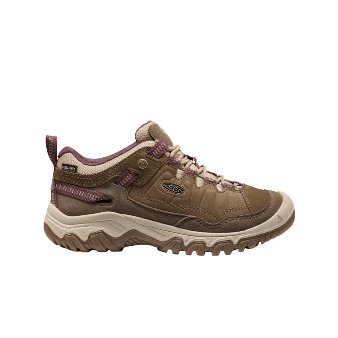 A brown and beige Keen hiking shoe with purple accents, shown in a side profile on a white background.
