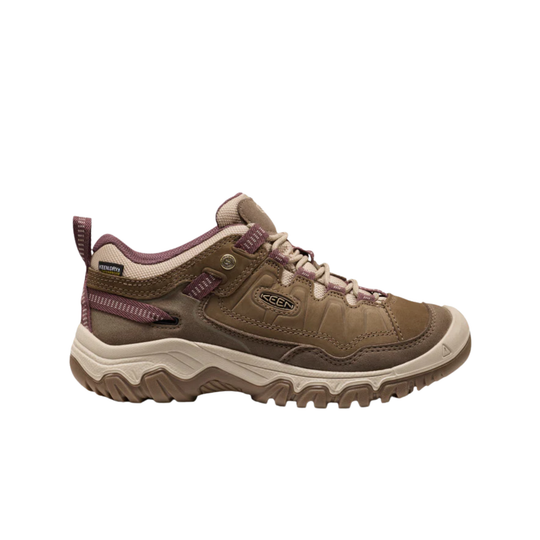 A brown and beige Keen hiking shoe with purple accents, shown in a side profile on a white background.