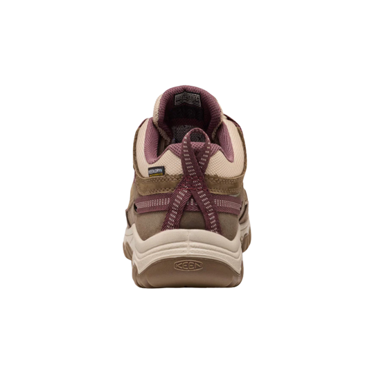 A single Keen brand hiking shoe shown from the rear on a solid white background, featuring a beige and brown upper with burgundy accents.
