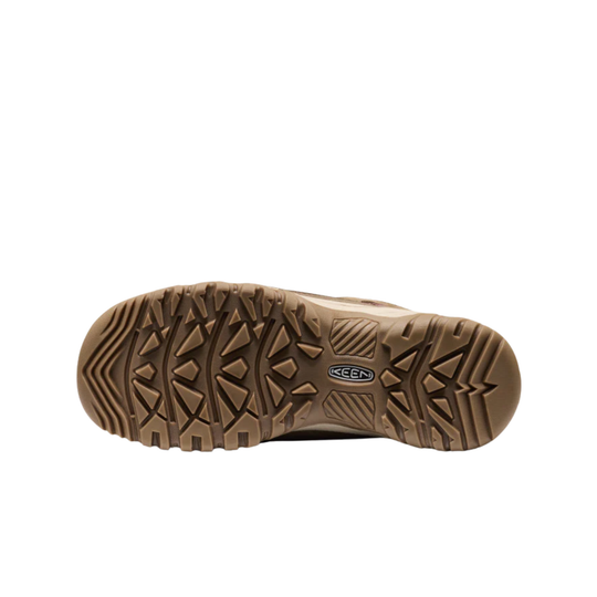 A top-down view of a brown Keen shoe sole, showing its textured tread pattern and the Keen logo embossed in the center, set against a plain white background.