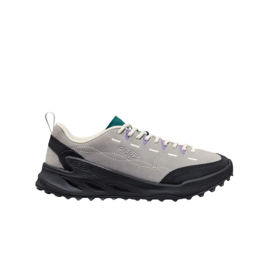 A light gray and black athletic sneaker with white laces, a small green tongue label, and subtle purple eyelet accents, shown from a side profile on a white background.
