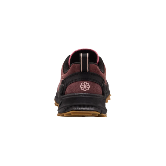 A single shoe shown from the back on a plain white background. The shoe features a dark brown and black upper with a small white floral logo on the heel, a pinkish-brown tongue lining, and a black and brown sole.