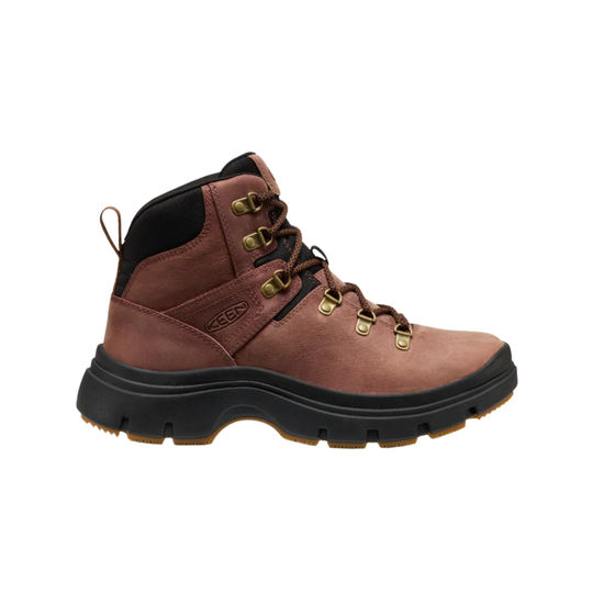 A single mid-cut hiking boot in brown leather with black trim, black laces, and brass-colored metal eyelets, shown from a side profile on a white background.