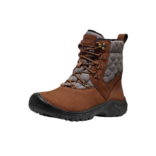 A brown ankle hiking boot with a quilted gray side panel, brown laces, and a black rugged sole, shown against a plain white background.