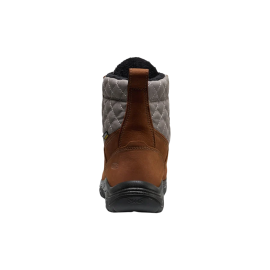 A brown ankle hiking boot with a quilted gray side panel, brown laces, and a black rugged sole, shown against a plain white background.