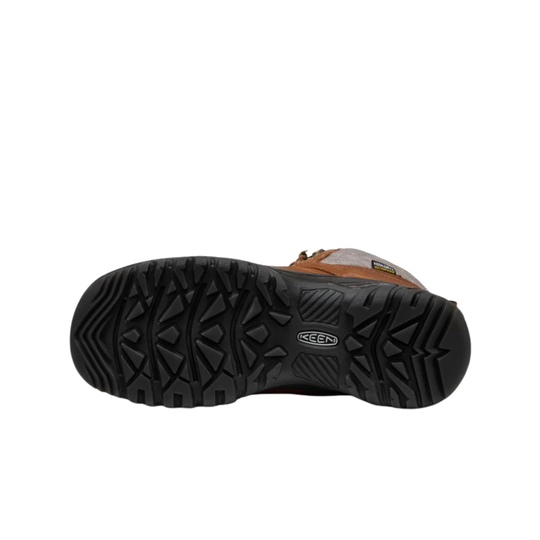 A brown ankle hiking boot with a quilted gray side panel, brown laces, and a black rugged sole, shown against a plain white background. Bottom black sole. 