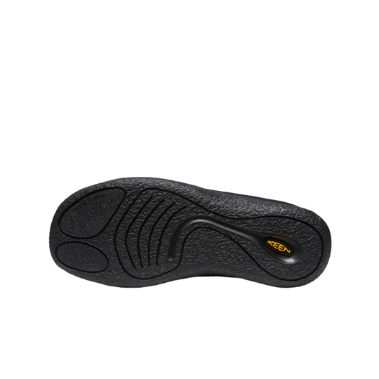 Black Keen shoe sole with textured grip patterns and a small yellow brand logo, shown against a plain white background.