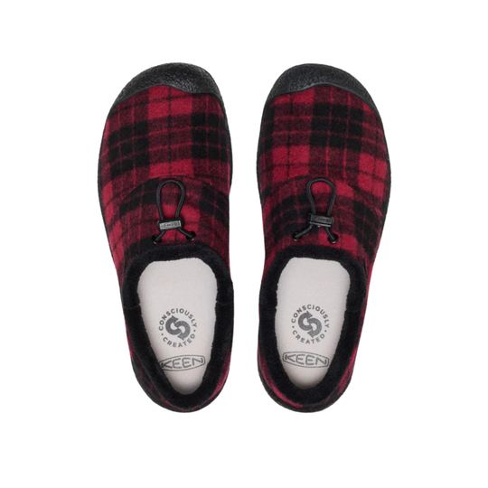 A pair of KEEN slip-on slippers in a red and black plaid pattern with black soles and white footbeds, shown from a top-down view on a white background.