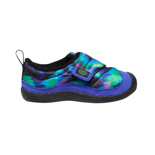 A single Keen shoe with a vibrant tie-dye pattern in green, blue, purple, and black, featuring a black sole and a blue hook-and-loop strap closure.