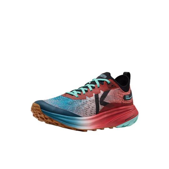 A single athletic trail running shoe shown in profile against a solid white background. The shoe features a textured knit upper in shades of teal, coral, and gray, a thick midsole with a blue-to-pink gradient, and a rugged brown outsole.