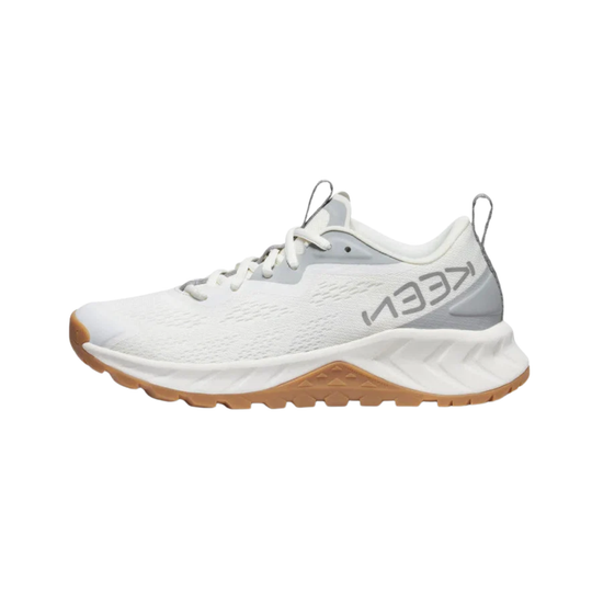 A white KEEn athletic shoe with a textured knit upper, white laces, a light gray heel counter, and a brown gum outsole, shown from a side profile on a white background.