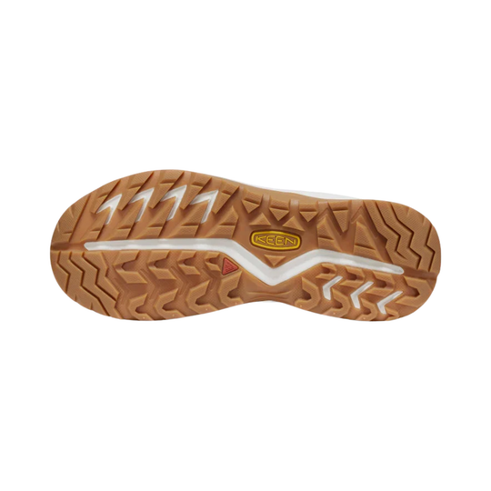 A close-up top-down view of a brown textured shoe sole with a white central stripe and a yellow Keen logo.