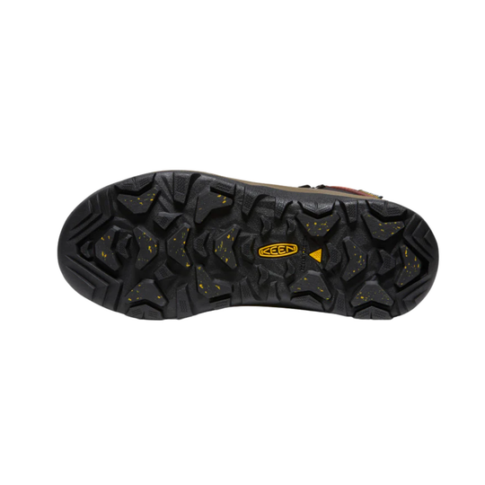 Close-up of a black shoe sole with a brand logo on a white background