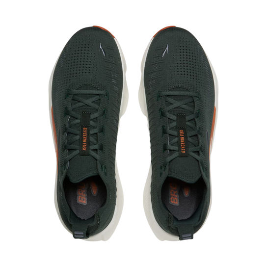 A pair of Brooks Ghost Fly running shoes in dark forest green with orange accents, shown from a top-down view on a white background.