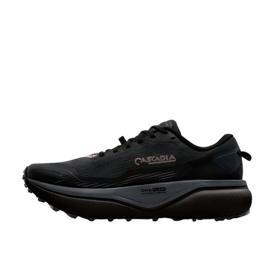 A black Cascadia trail running shoe with a thick black and gray midsole and a small rose gold logo on the side, shown against a plain white background.